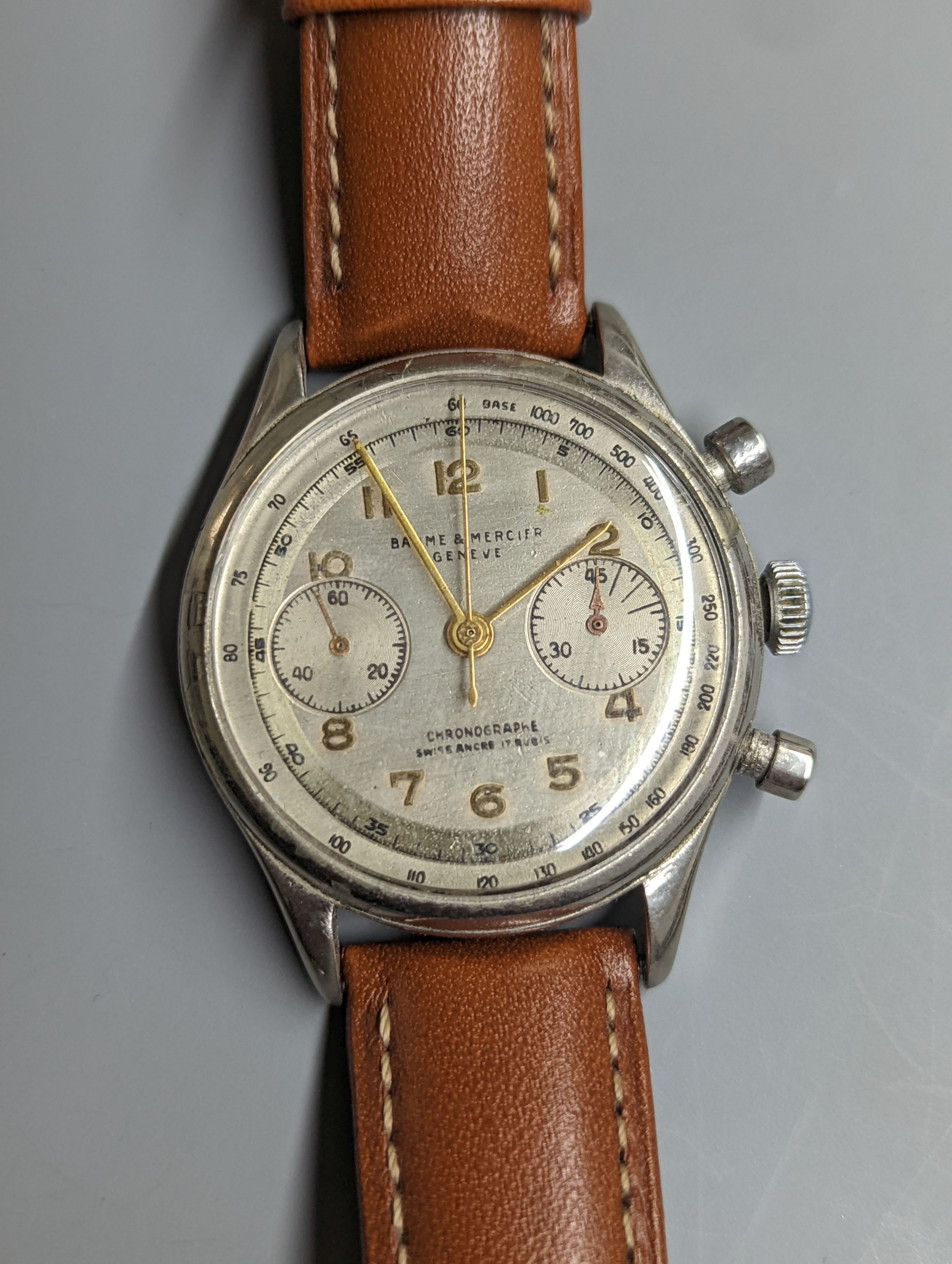 A gentleman's stainless steel Baume & Mercier Chronographe wrist watch, with Arabic numerals and two subsidiary dials, case diameter 35mm, on a later associated leather strap.